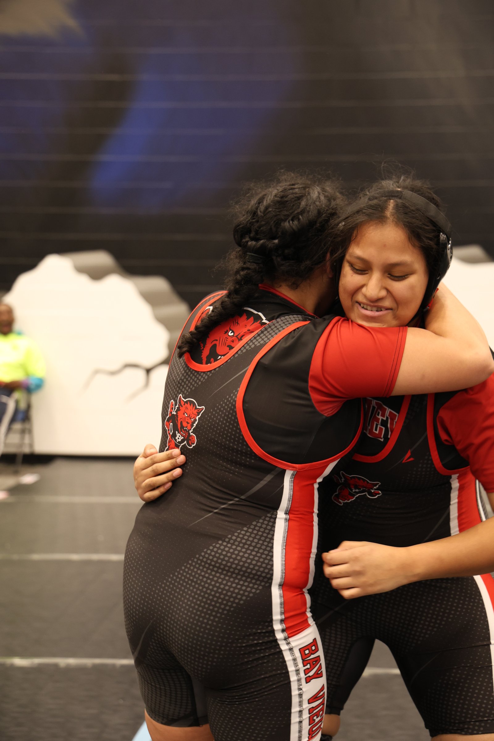 Team members embracing after a match